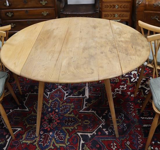 An Ercol light elm drop leaf table W.116cm extended